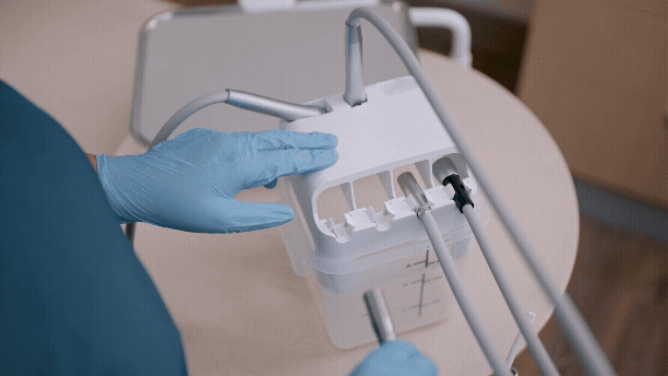 Hands-free flushing with the A-dec Flush Dock.