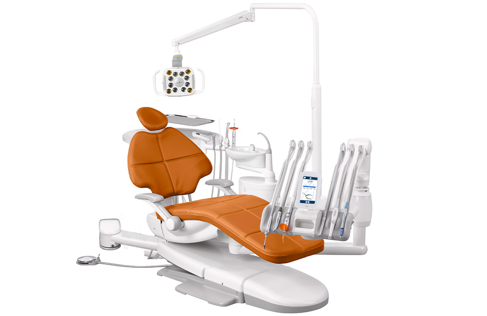 A-dec 500 dental chair with Apricot upholstery and other dental equipment