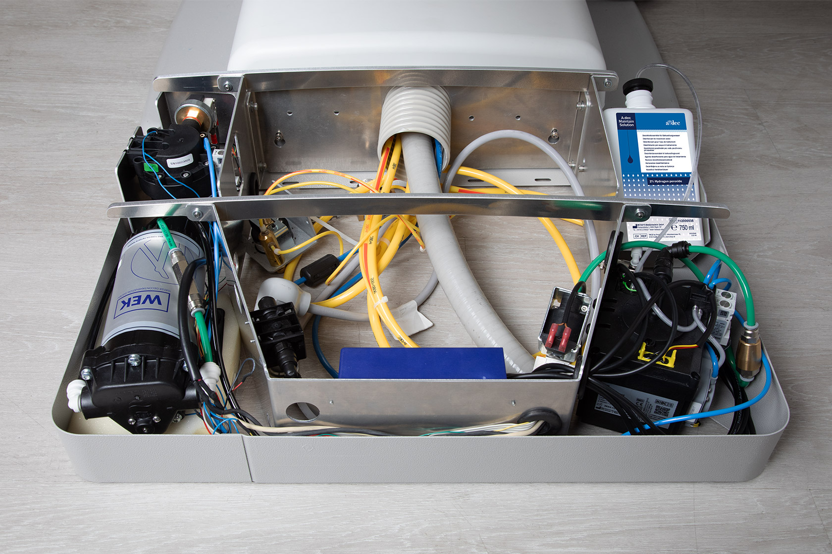 Front view of open floor box showing A-dec Maintain DUWL solution