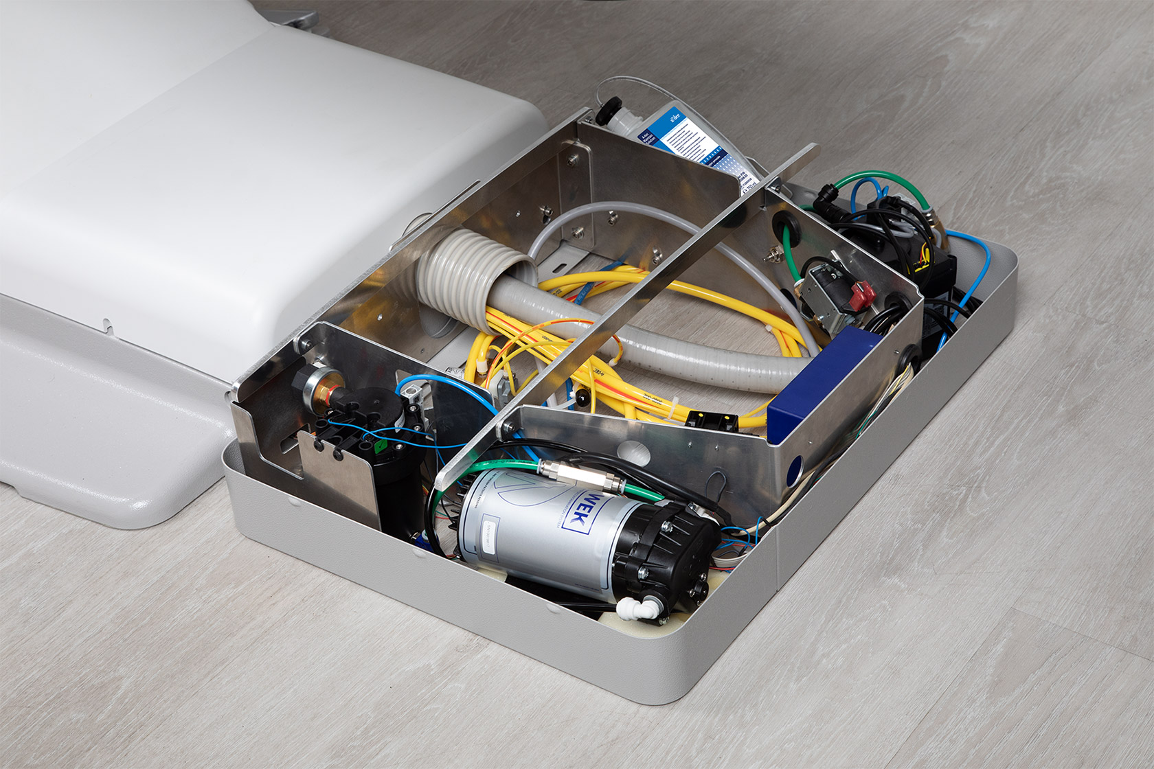 Angled view of open floor box showing A-dec Maintain DUWL solution